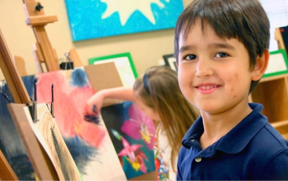 Children painting in a Lupine Lane art class