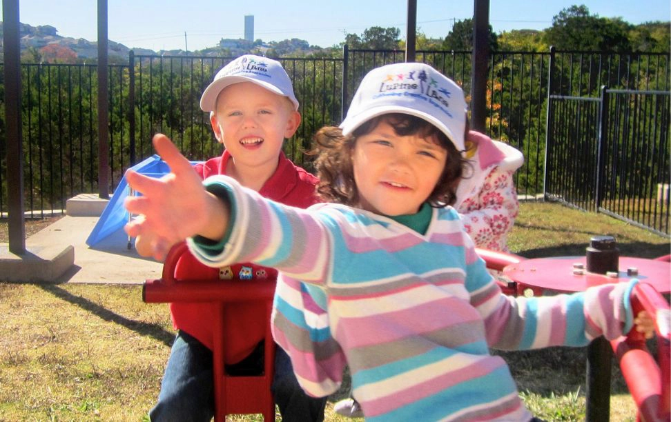 Two children playing on the Lupine Lane preschool playground
